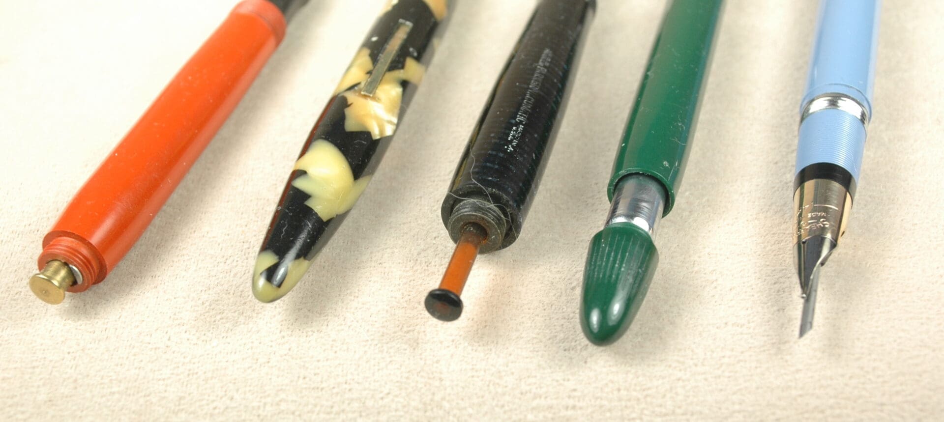 Four vintage pens with different designs. Four vintage pens with different designs.