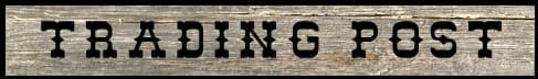 Wooden sign with 'Trading Post' text. Wooden sign with 'Trading Post' text.
