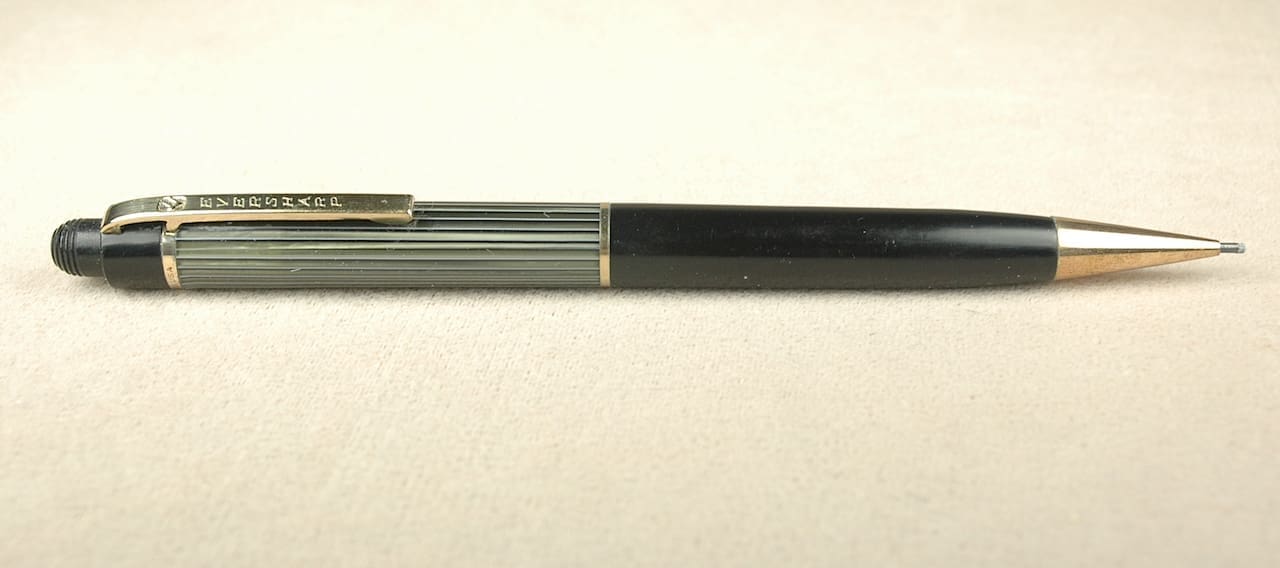 Black and gold mechanical pencil on table.