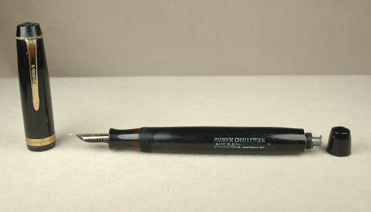 Black vintage fountain pen with cap removed.