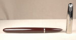 Brown fountain pen with silver cap.