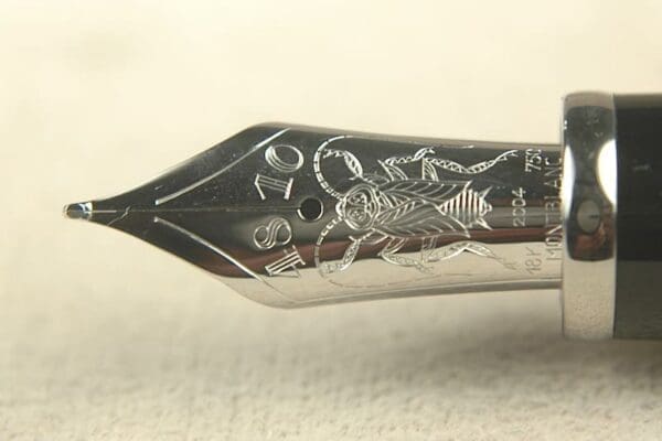 Fountain pen nib with intricate engraving.