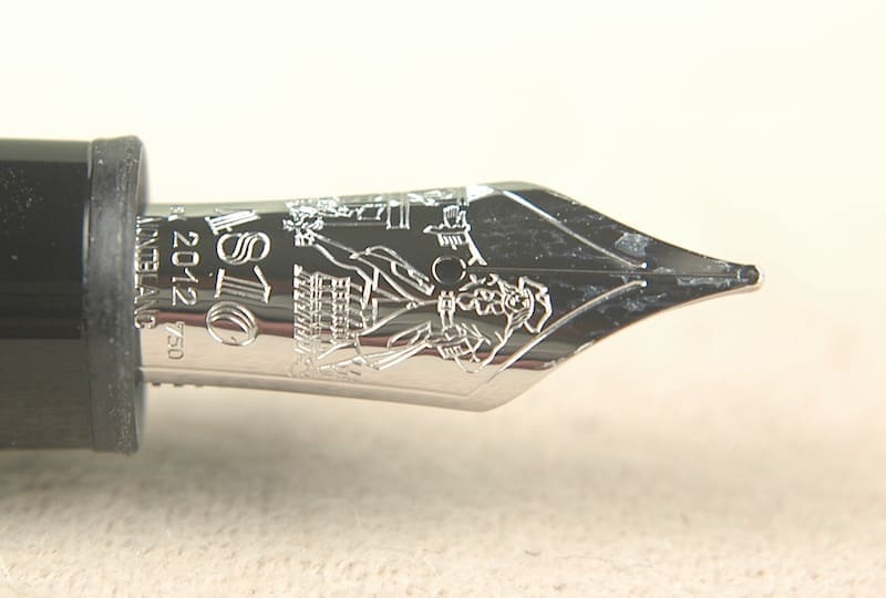 Close-up of intricate metal fountain pen nib.