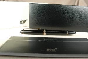 Montblanc pen with packaging and documents.