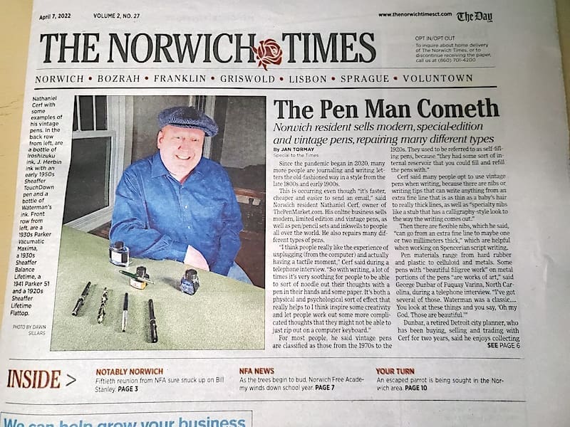 Newspaper featuring a pen enthusiast article.
