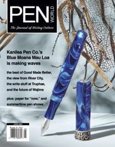 Blue pen on magazine cover with text.