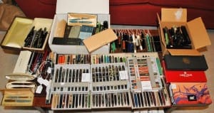 Collection of various pens in boxes.