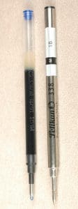 Two pen refills on a light background.
