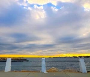 Ocean view with dramatic cloudy sky.