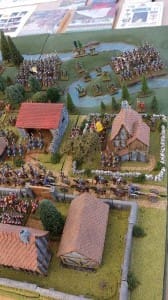 Miniature medieval village with detailed landscape.