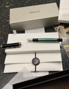 Luxury fountain pen with packaging on display.