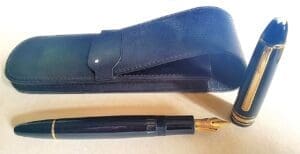 Black fountain pen with leather case.