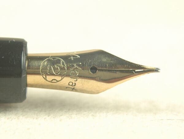 Gold fountain pen nib, close-up view.