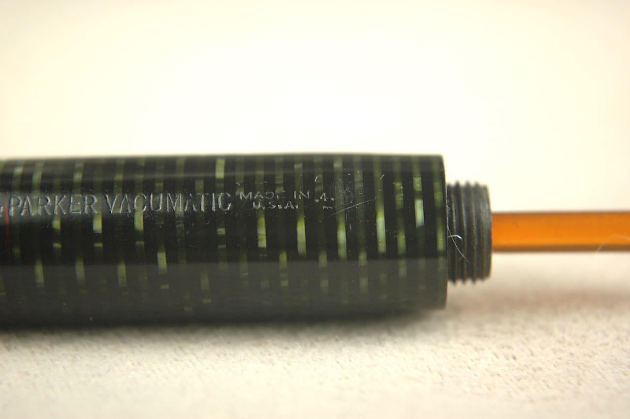 Close-up of a black mechanical pencil with visible lead.