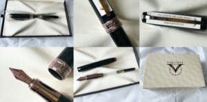 Luxury wristwatch and pen on a white surface with papers.