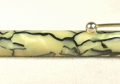 Vintage pen with marbled barrel design.
